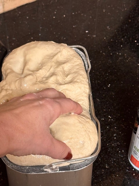snagging a handful of dough