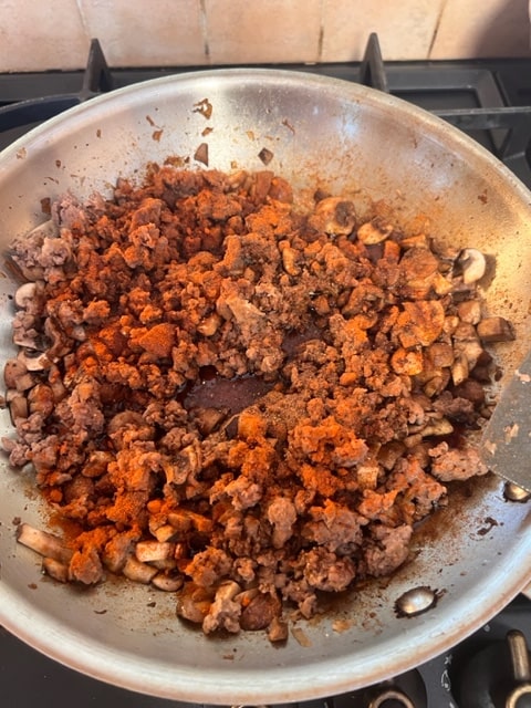 adding the spices to the meat