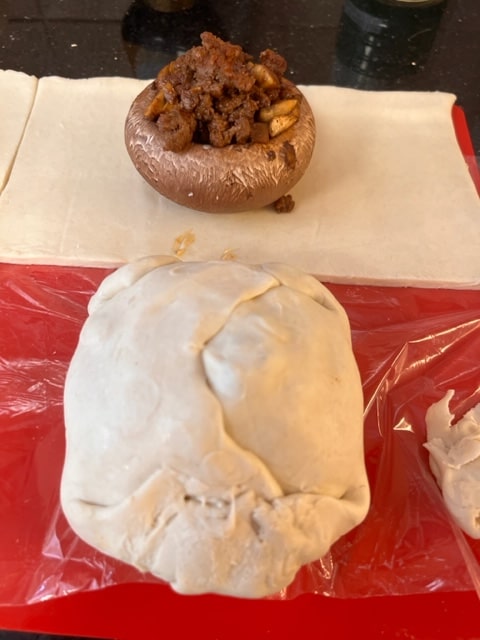 cut the pastry in squares to fit the mushrooms