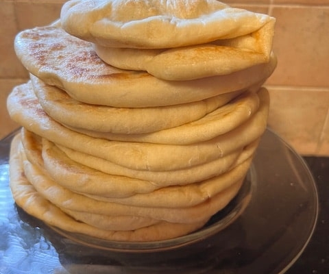 stack of flatbreads - top one is folded