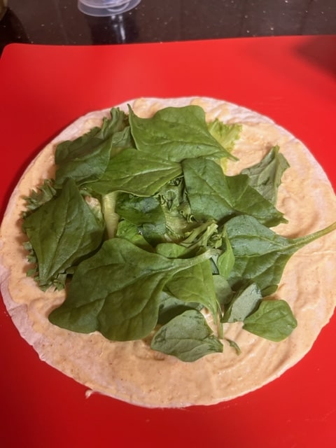 layer on the spinach leaves
