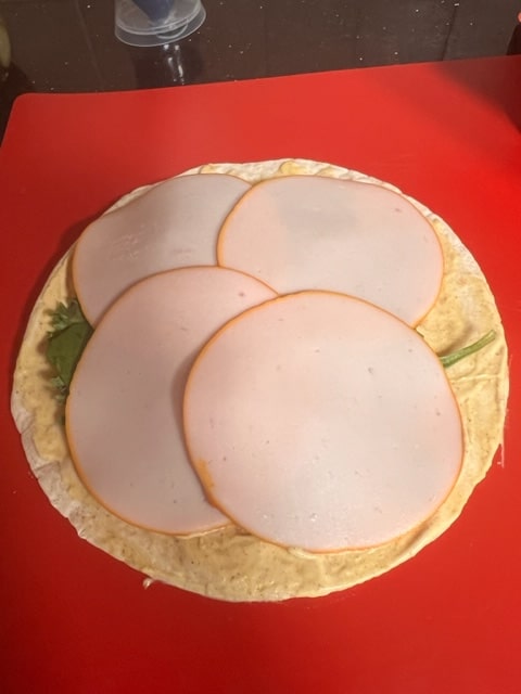 adding the turkey slices