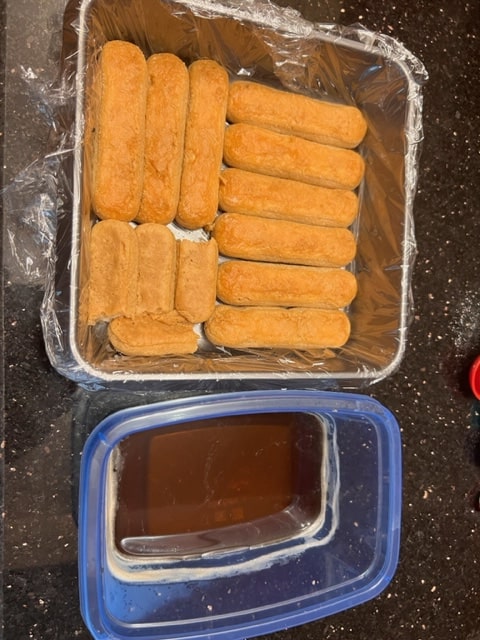 fitting the ladyfingers in the pan