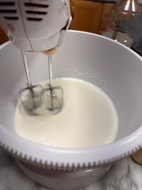 starting the whipping of the whites with the sugar
