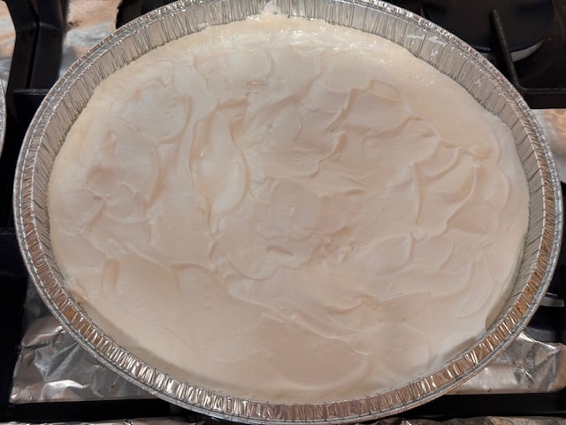 covering lemon mixture with meringue