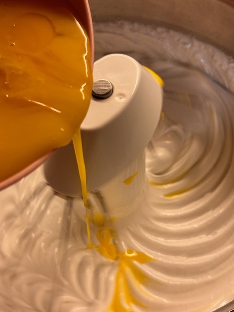 adding the yolks, juice and oil