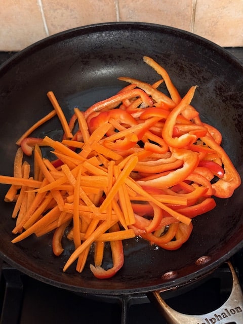 stir fry the carrots and peppers