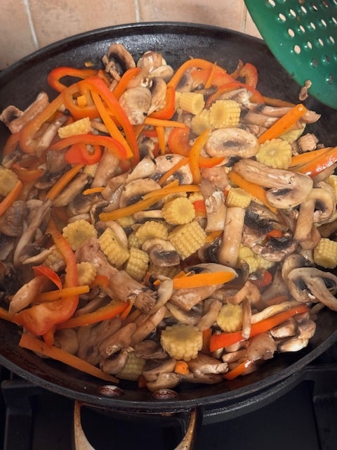adding the corn and tofu