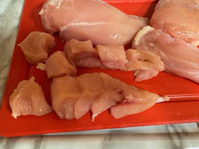 cut chicken breast into 1 inch pieces