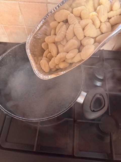 pouring the gnocchi into seriously boiling water