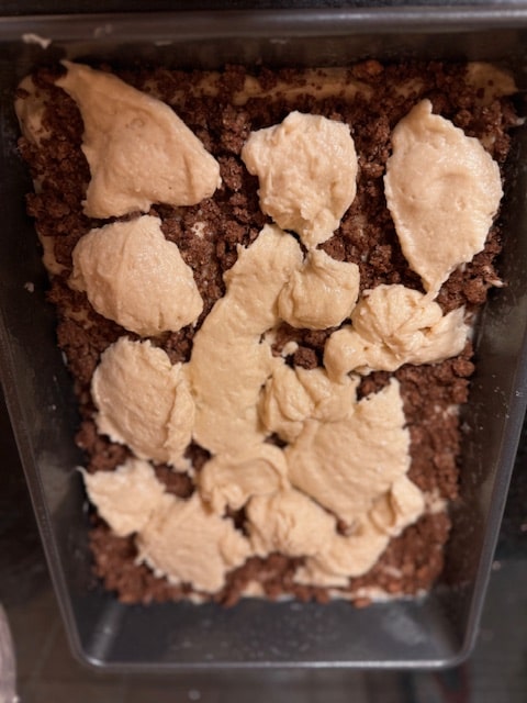 dollop the second layer of batter over the crumbs