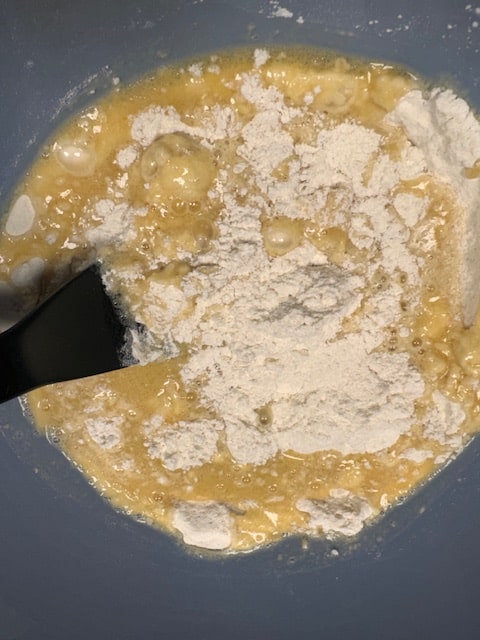 adding wet ingredients to dry