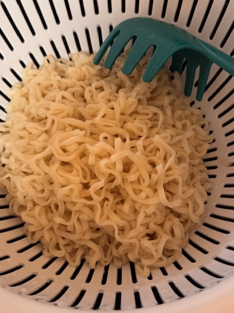 draining the noodles
