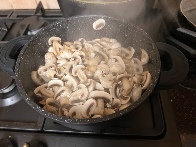 start tossing mushrooms and onions together