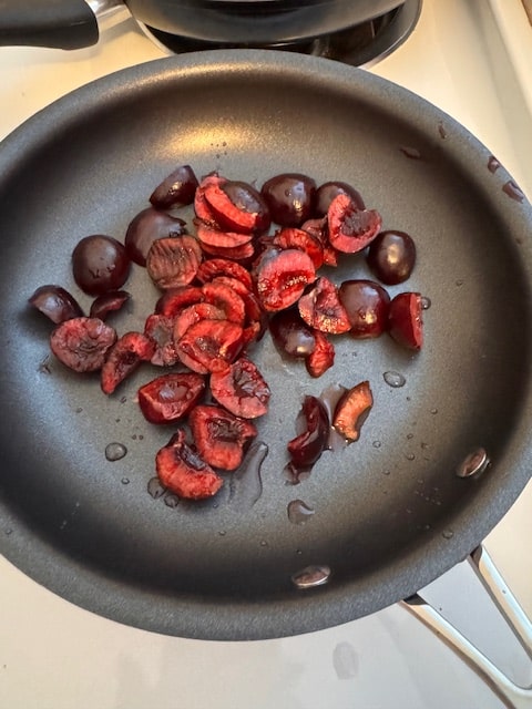 halved cherries in pan