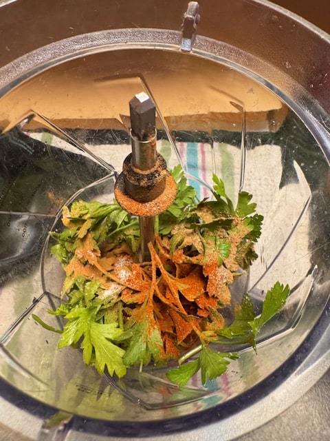 parsley, spices, garlic and onion in blender or food processor