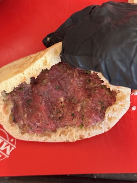 stuffing pitas with meat mixture