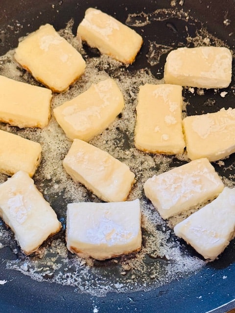 frying the halloumi in oil in the pan