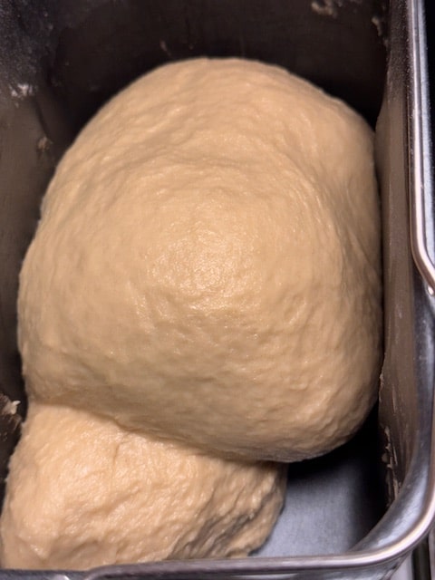 dough forms a smooth ball