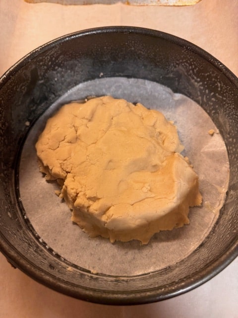 place dough in pan with parchment