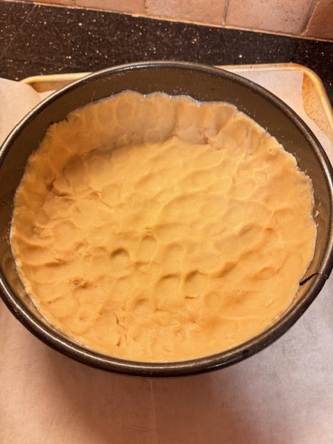 dough pressed into bottom and sides of pan