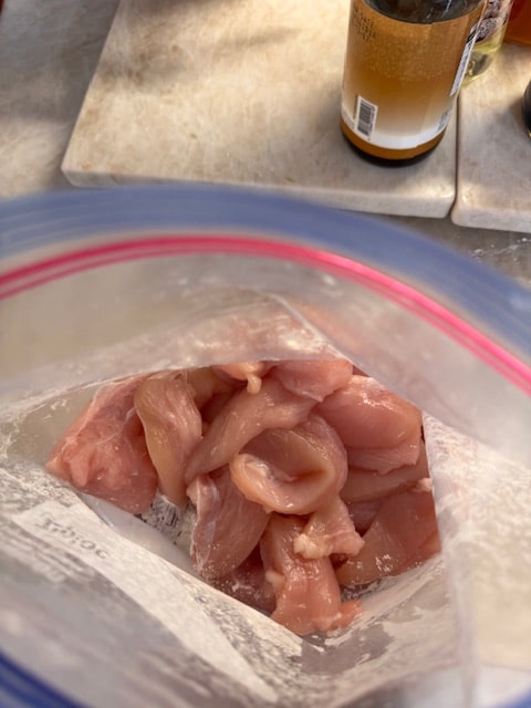 place chicken pieces in bag with cornstarch