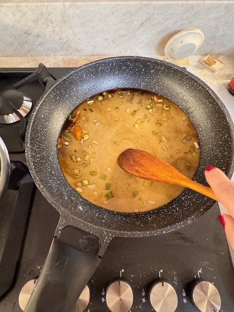adding cornstarch with water to sauce