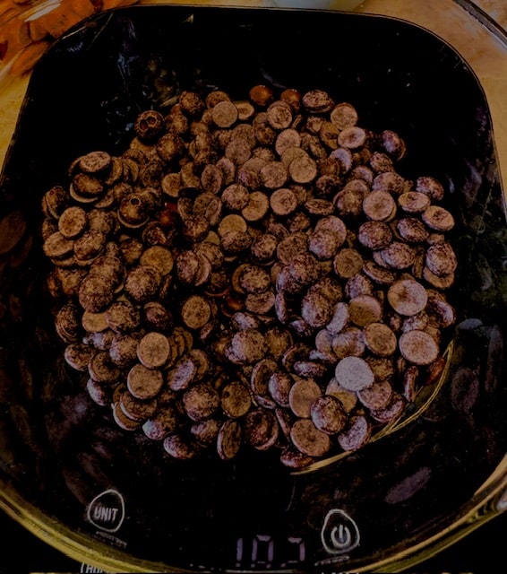 weighing the chocolate disks