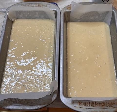pour more or less evenly into 2 loaf pans