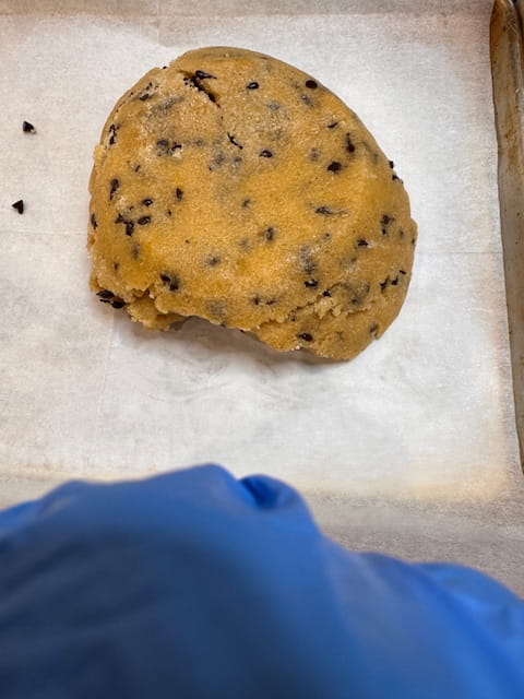 scooping dough into pan