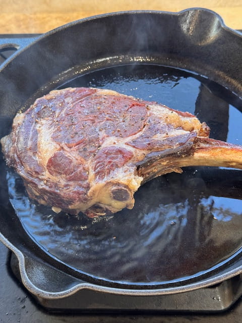 Place steak in smoking hot oil