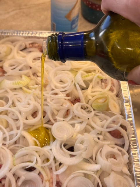 drizzle olive oil over top layer of onion
