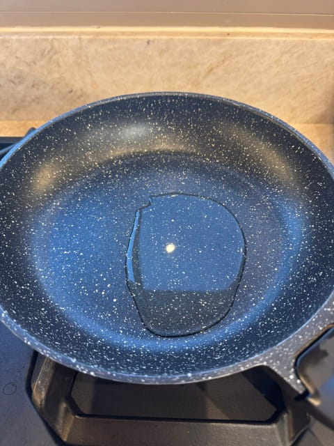 heat the oil in the pan