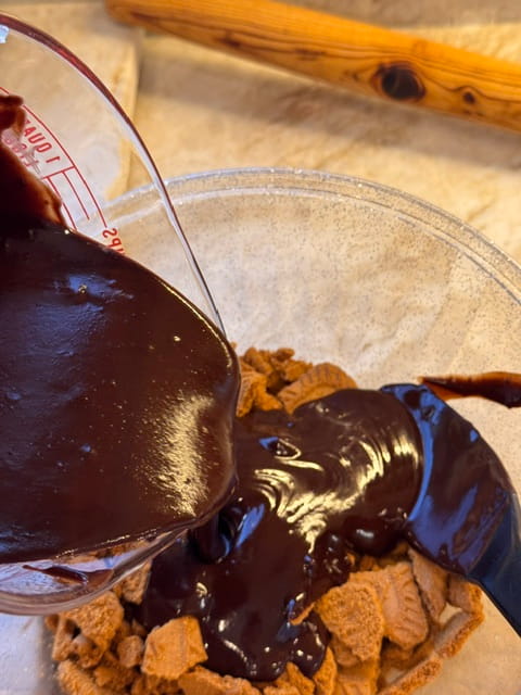 pour chocolate mixture over cookies