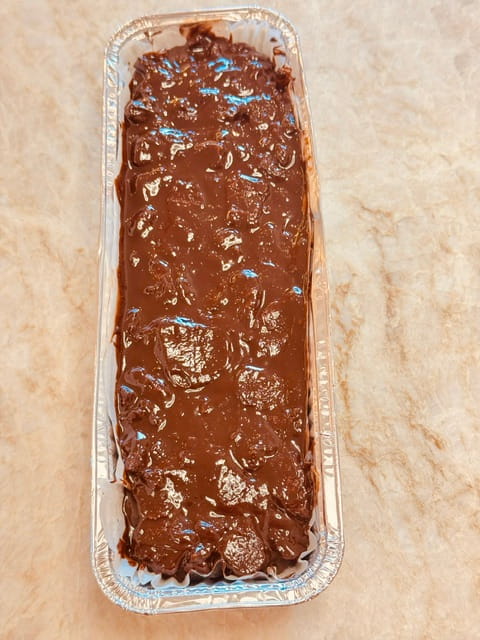 pour into parchment lined  long loaf pan