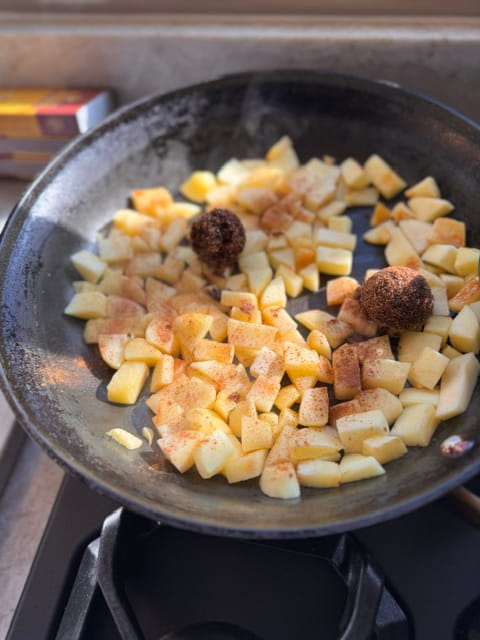 put chopped apples into pan with oil, cinnamon, salt and brown sugar